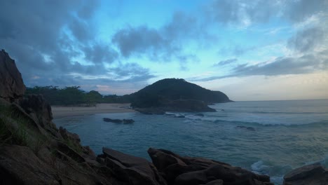 time lapse of a sunset on a cloudy day at trindade beach, rio de janeiro, brazil
