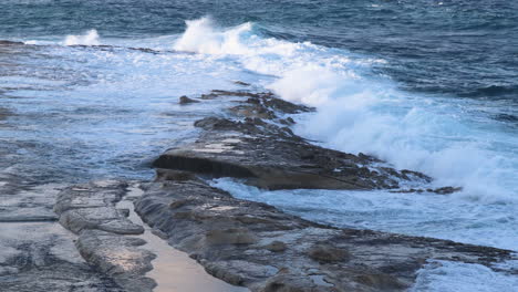 4k waves crashing on to rocks in malta