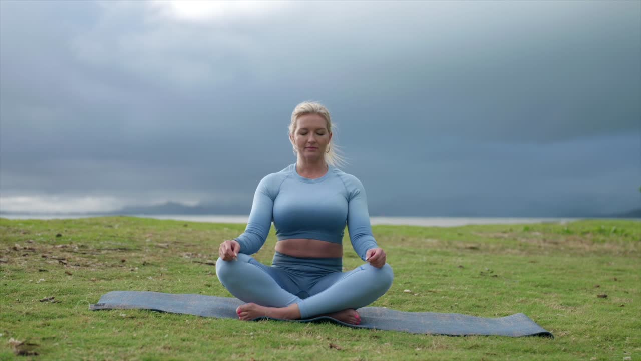 Female deep breathing in fitness attire