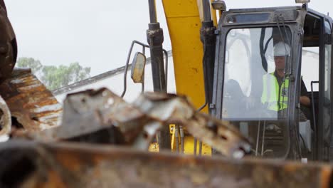 Male-worker-operating-excavator-machine-4k