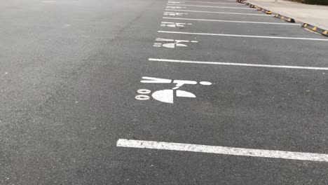 upward pan of specially allotted parking spots for vehicles with baby prams