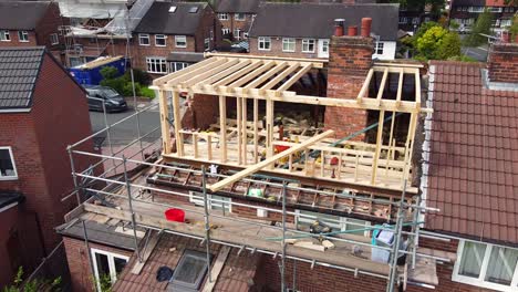 aerial shot pans across a semi-detached house having a dormer loft conversion