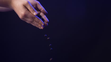 Coffee-beans-poured-out-of-hands