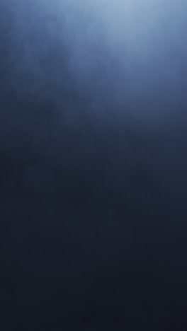 video vertical de humo blanco moviéndose sobre un fondo negro