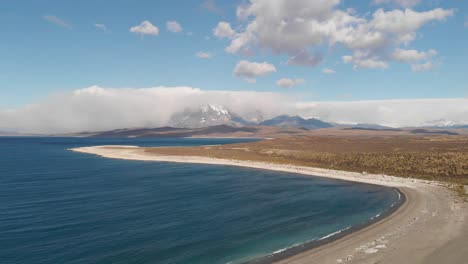 drone fly at patagonia torres del paine blue lagoon, daylight skyline background national park