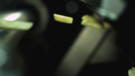 close-up - slow motion of french fries automatically being sorted in a food factory