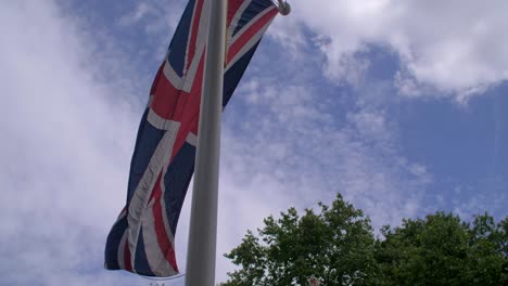 4k british flags leading into buckingham palace london england capital slider shot