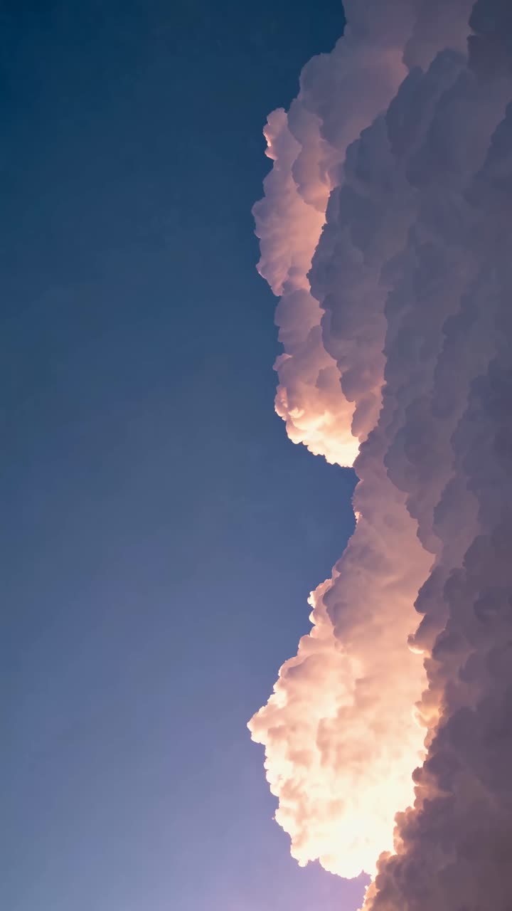 Vertical video capturing dramatic clouds with a low-angle view, highlighting their texture