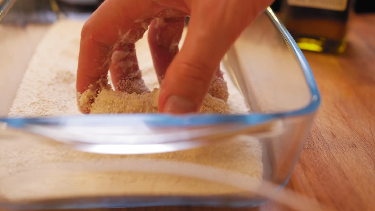 rolling food in breadcrumbs