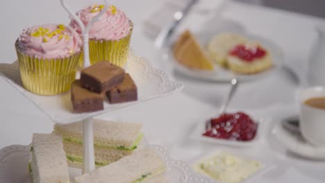 Studio Shot Of Traditional British Afternoon Tea With Sandwiches Cake Scones Cream And Jam 1