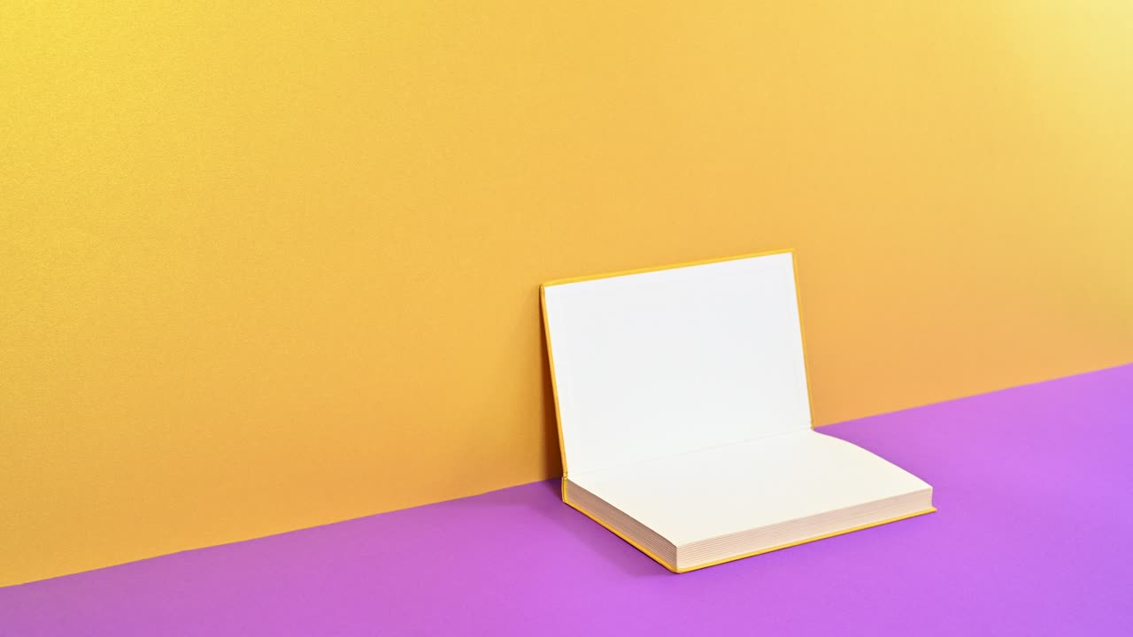 Golden hardcover vintage book open on golden purple theme. Minimal stop motion animation