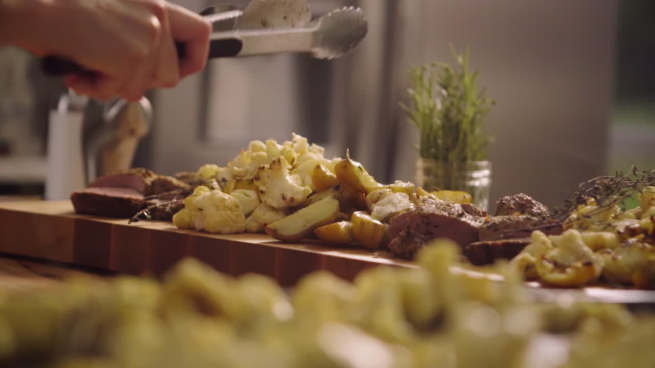 Food is picked up with tongs and served