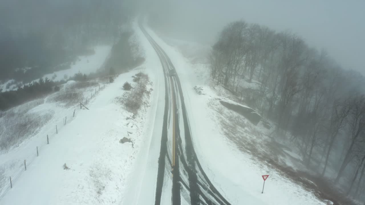 Winter snow covered road Blue Ridge Parkway, Boone, NC, USA aerial drone