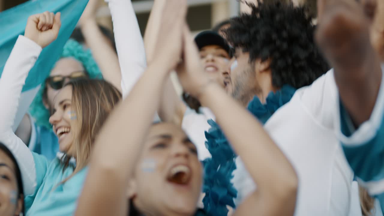 Soccer fans cheering for their national team