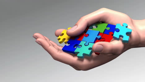 hand holding colorful puzzle pieces