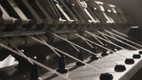 spinning machine producing thread from yarn, textiles factory in pakistan