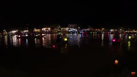 hoi an’s nightly glow, the lanterns sway, casting colours along the bay, timelapse