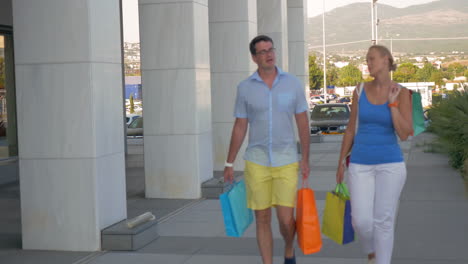 young couple walking down the street of thessaloniki greece