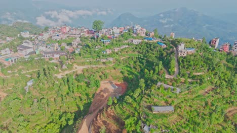 this aerial video shows manakamana hill in gorkha, nepal, a spiritual and scenic site known for its hindu temple, panoramic mountain views, and the cable car that connects pilgrims to the hilltop
