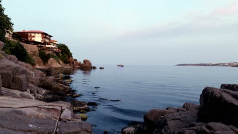 evening cruise boat navigates calm bay of sozopol at sunset black sea coast