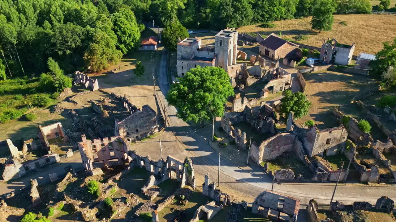 Aerial of Oradour sur Glane ruins, abandoned village preserved as WWII memorial site, panoramic establishing