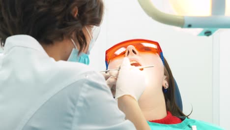 dentist examining patient's teeth