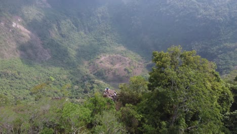 Aerial-flyover-reveals-tourists-on-rim-of-San-Salvador-volcano-crater