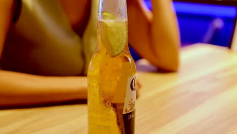 cold beer with lime on a table