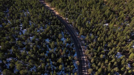 Snow-Peak-Mountains-Forest-Highway-Road-Car-Aerial-Pan-Up-Shot-4K