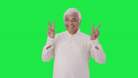 Happy-Indian-old-man-showing-victory-sign-Green-screen