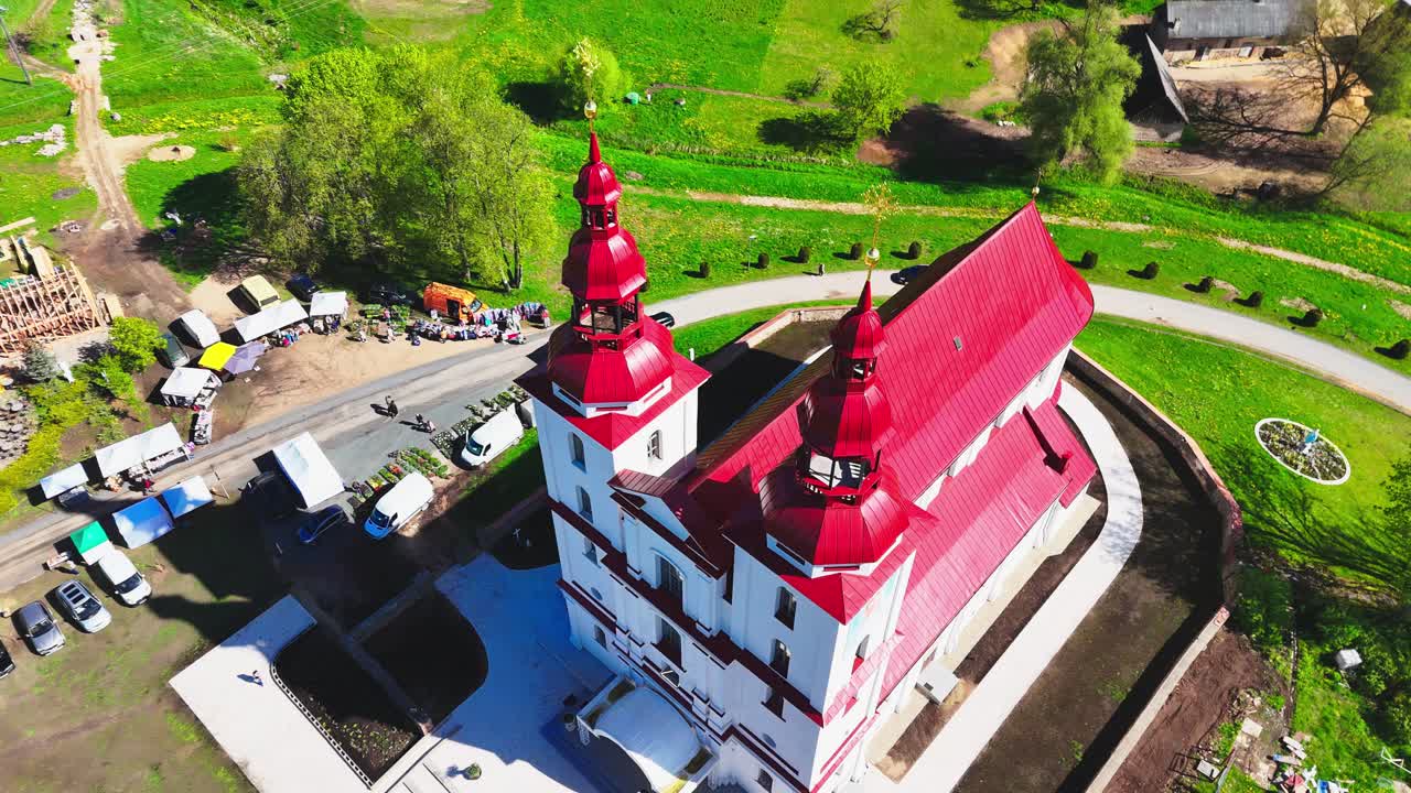 Drone establishing aerial fly above Religious building landscape in Lithuania at morning daylight