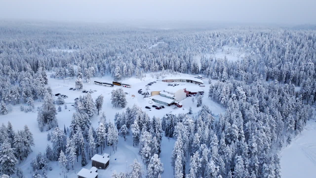 Aerial view tilting toward the Sallan Poropuisto, cloudy, winter day in Finland
