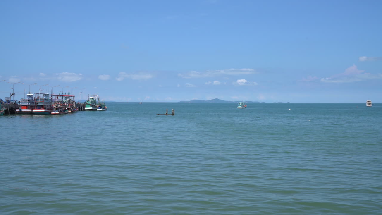 Fishing Boats at a Calm Sea on a Sunny Day