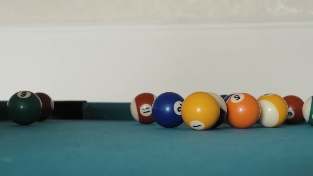 Amateur Breaking balls on a pool table