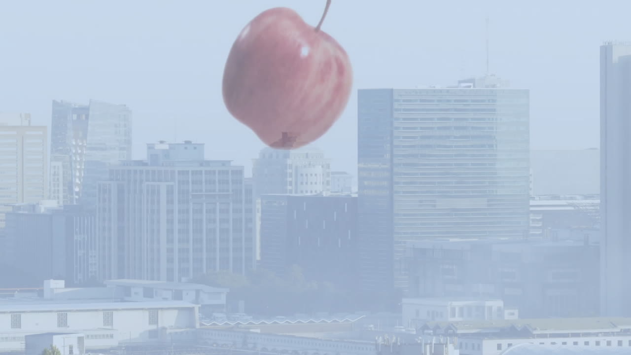 Hovering giant peach over city skyline with animation of tall buildings