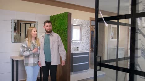 couple exploring modern bathroom display