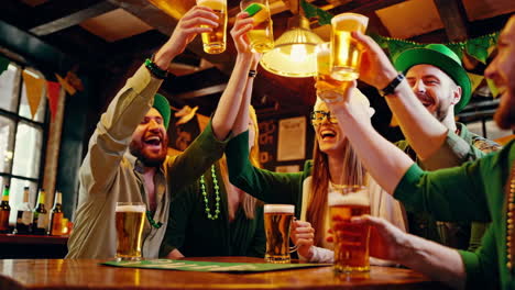 friends celebrating st. patrick's day with a beer toast in a lively pub