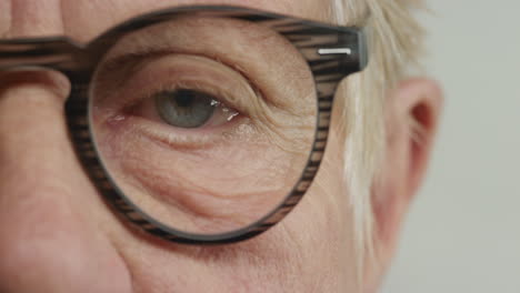 close-up-macro-eye-old-woman-wearing-glasses-aging-beauty-healthy-eyesight-concept