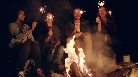 friends celebrating around campfire