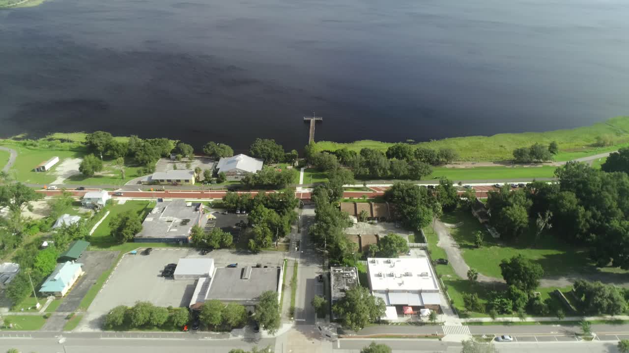 "Clermont, FL - USA - 8-24-2020: Bird's eye view tilt and push in shot over historic downtown Clermont."