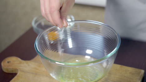 Unhealthy-food-ingredient.-Chef-adding-salt-to-protein-in-glass-bowl