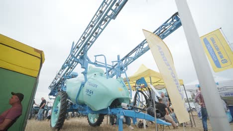 demonstration of agricultural machinery at an exhibition. tractors operate in the field, showcasing their capabilities and performance in action