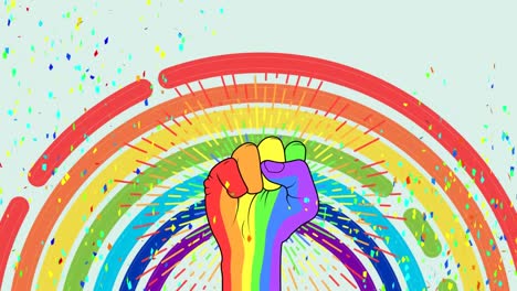 animation of rainbow with rainbow fist sign of power and falling confetti on pale blue