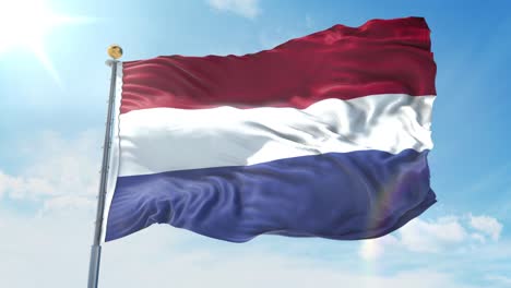 netherlands flag waving in the wind against deep blue sky. national theme, international concept. 3d render seamless loop 4k