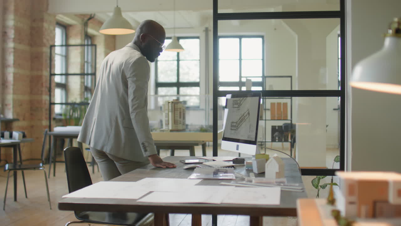 Professional Architect Working on Designs in a Modern Office
