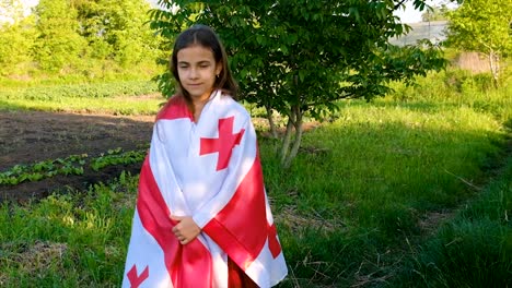 patriot child with georgian flag. selective focus. nature.