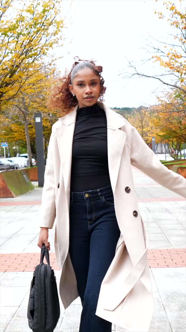 Fashionable Woman Walking in City during Autumn