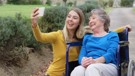 senior woman and young girl taking selfie 4k