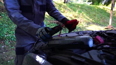 mechanic turning power to a car