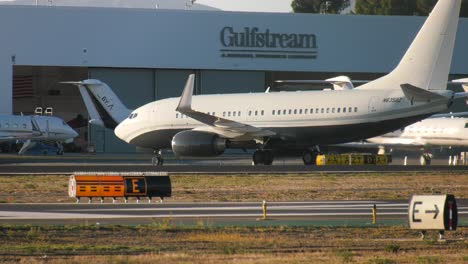 airplane-passing-busy-runway-in-california